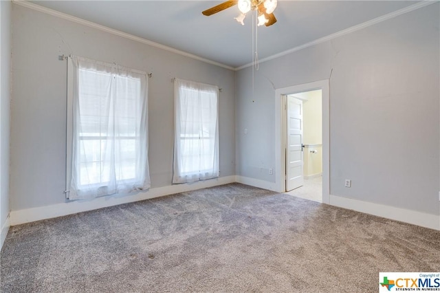 carpeted empty room featuring crown molding and ceiling fan