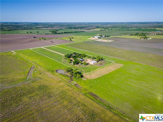 birds eye view of property with a rural view