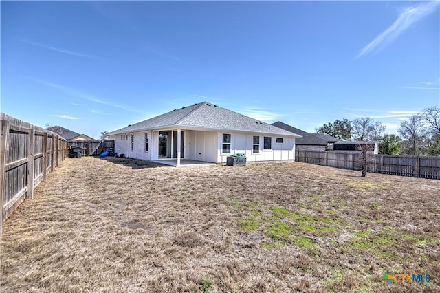 back of property featuring a patio area and a fenced backyard