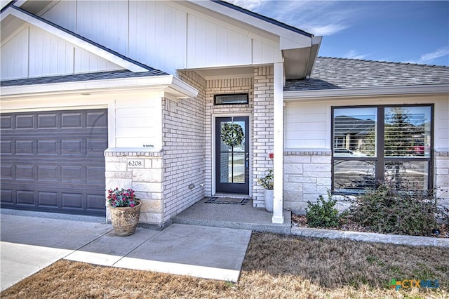 property entrance with a garage, brick siding, concrete driveway, and roof with shingles