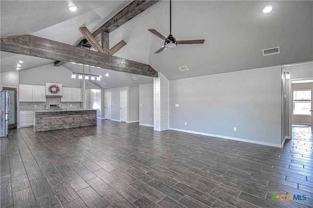 unfurnished living room featuring baseboards, a ceiling fan, visible vents, and wood tiled floor