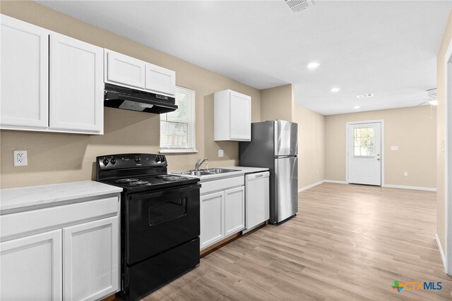 kitchen featuring stainless steel refrigerator, sink, dishwasher, black range with electric cooktop, and white cabinets