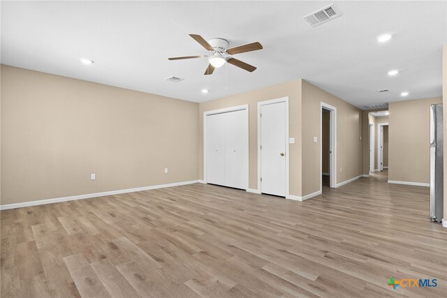 interior space with light hardwood / wood-style floors and ceiling fan