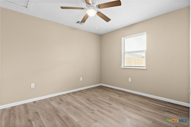 empty room featuring ceiling fan and light wood-type flooring