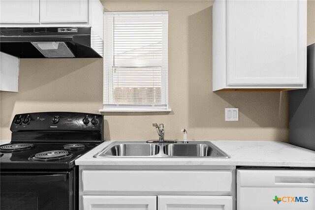 kitchen with white dishwasher, sink, black range with electric cooktop, white cabinetry, and extractor fan