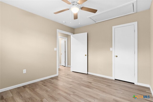 unfurnished bedroom featuring ceiling fan and light hardwood / wood-style floors