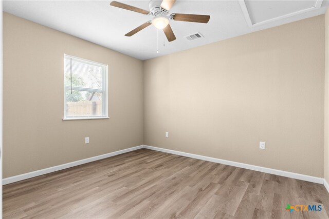 empty room featuring ceiling fan and light wood-type flooring