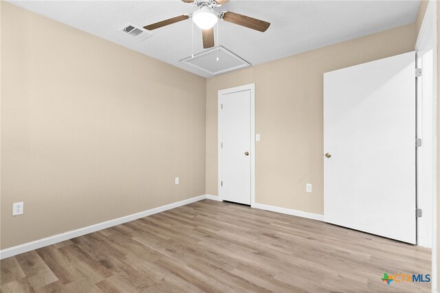 unfurnished bedroom with light wood-type flooring and ceiling fan