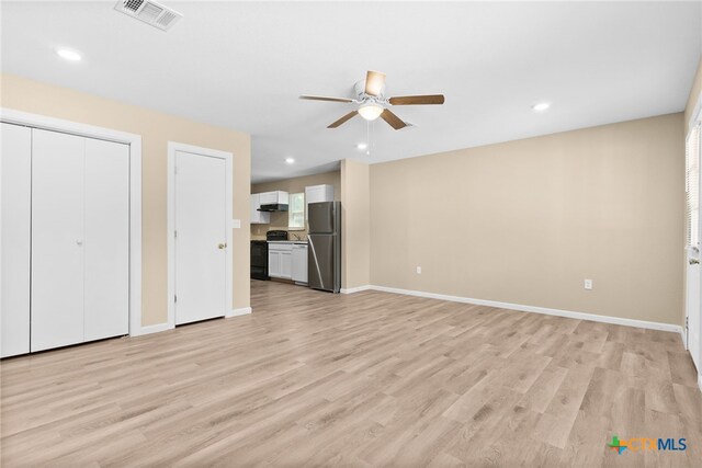 unfurnished living room with ceiling fan and light hardwood / wood-style floors