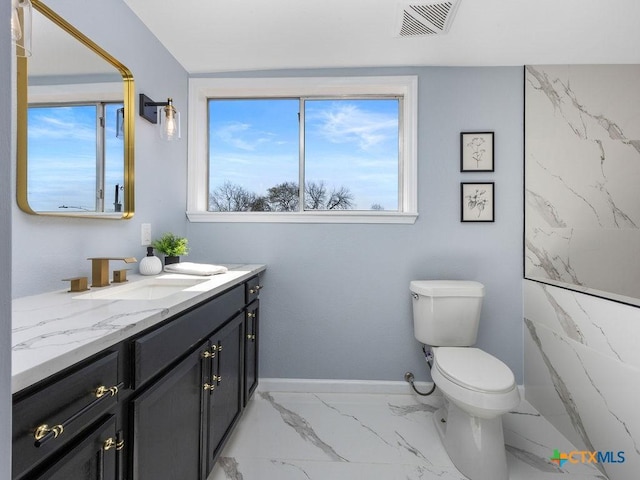 187 Meadow Ave, New Braunfels, TX 78130 - bathroom with vanity, toilet, baseboards, marble finish floor, and visible vents