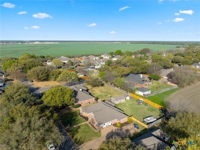 drone / aerial view with a residential view and a rural view