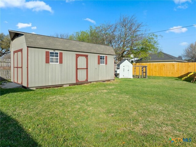 view of shed with a fenced backyard