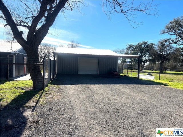 garage featuring a lawn