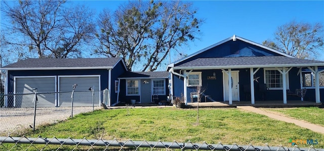 view of front facade with a garage, a front yard, and covered porch