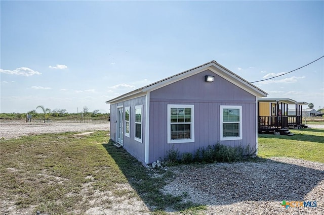 143 S Quailrun Ave, Port Lavaca, TX 77979 - view of side of home with a yard