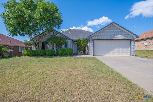 ranch-style home with a garage and a front yard