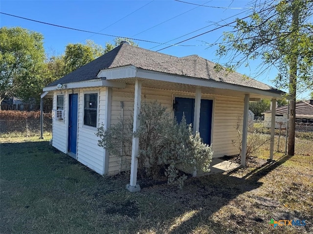 view of side of home featuring a lawn