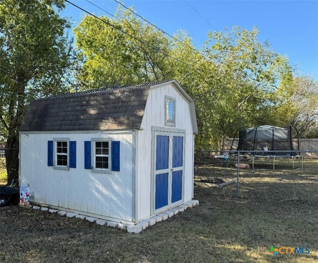 view of outbuilding featuring a trampoline