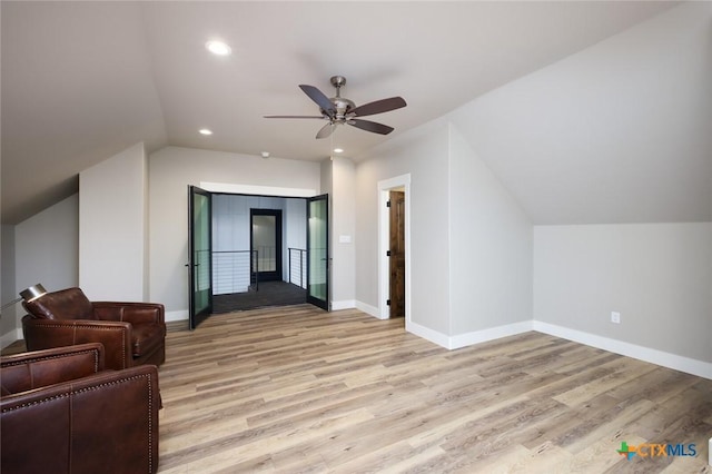 additional living space with ceiling fan, lofted ceiling, and light hardwood / wood-style flooring