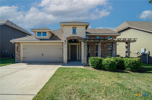 view of front of house with a garage and a front yard