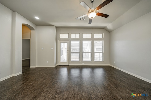 unfurnished room featuring dark wood-type flooring, ceiling fan, and vaulted ceiling