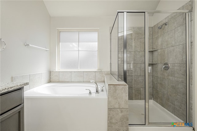 bathroom featuring vanity and plus walk in shower