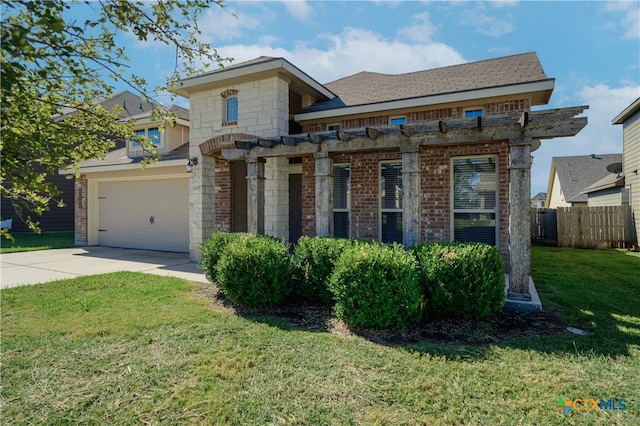 view of front of house featuring a garage and a front yard