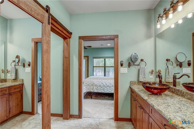 bathroom with tile patterned flooring and vanity