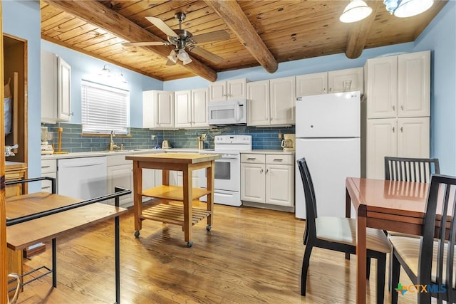 2662 Edgegrove, Canyon Lake, TX 78133 - kitchen featuring white appliances, a wooden ceiling with exposed beams, white cabinets, light countertops, and ceiling fan