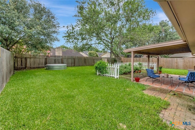 112 Laramie Dr, Victoria, TX 77904 - fenced backyard featuring a patio area