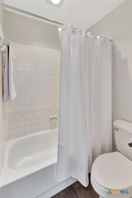 112 Laramie Dr, Victoria, TX 77904 - full bathroom featuring shower / bath combo with shower curtain and wood finished floors