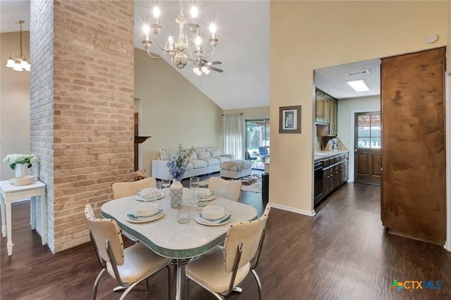 112 Laramie Dr, Victoria, TX 77904 - dining area with a chandelier, dark wood-style floors, and high vaulted ceiling
