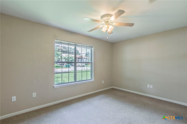 1012 N Beal St, Belton, TX 76513 - empty room with a ceiling fan and carpet