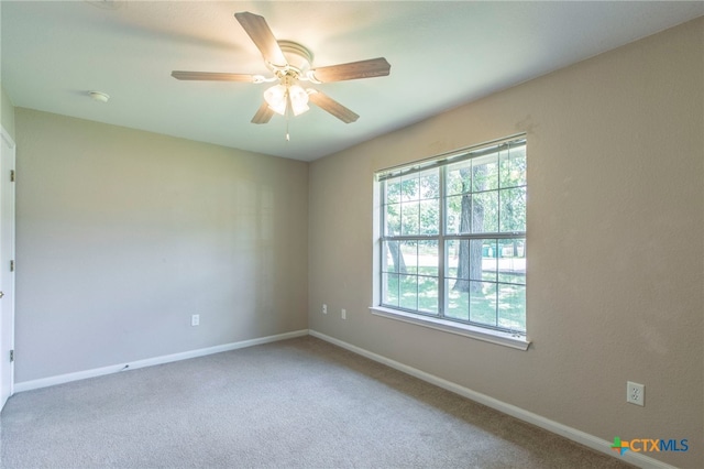 1012 N Beal St, Belton, TX 76513 - spare room with carpet floors, a ceiling fan, and a smoke detector