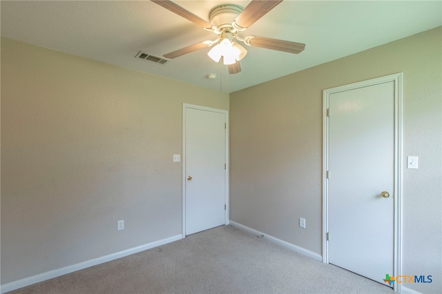 1012 N Beal St, Belton, TX 76513 - unfurnished bedroom featuring light carpet and a ceiling fan