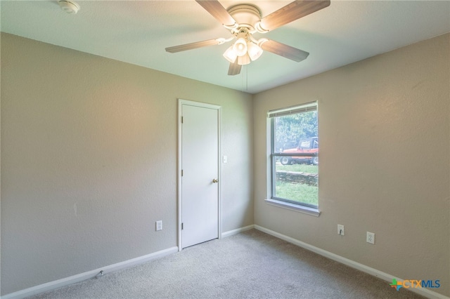 1012 N Beal St, Belton, TX 76513 - unfurnished room featuring light carpet, a smoke detector, and a ceiling fan