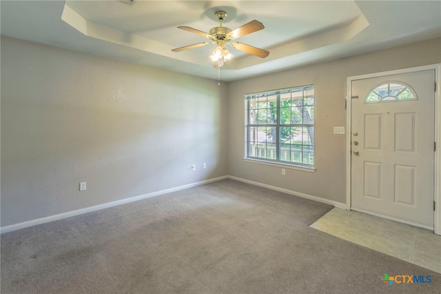 1012 N Beal St, Belton, TX 76513 - carpeted entrance foyer with a tray ceiling, healthy amount of natural light, and ceiling fan