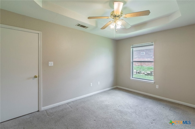 1012 N Beal St, Belton, TX 76513 - carpeted empty room featuring ceiling fan and a raised ceiling