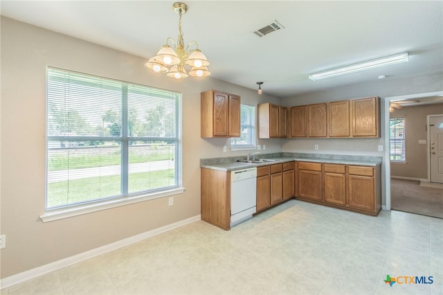 1012 N Beal St, Belton, TX 76513 - kitchen featuring dishwasher, plenty of natural light, a chandelier, and brown cabinetry