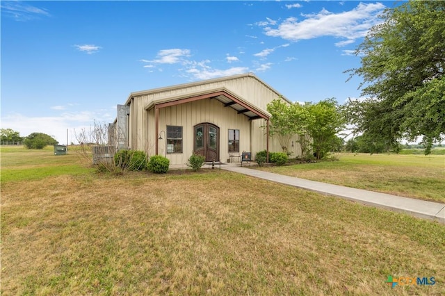 592 Dagg, Yoakum, TX 77995 - view of front facade with a front lawn and french doors