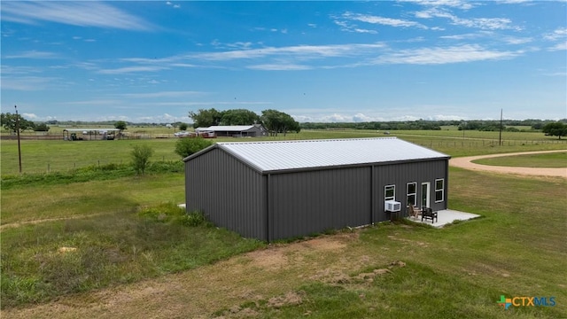 592 Dagg, Yoakum, TX 77995 - view of pole building with a rural view, a lawn, and cooling unit