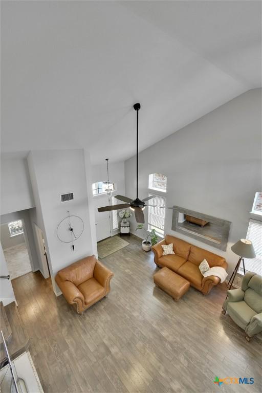 3405 Campanella Dr, Round Rock, TX 78665 - living room with ceiling fan, plenty of natural light, wood finished floors, and lofted ceiling