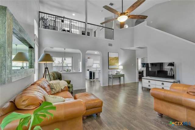 3405 Campanella Dr, Round Rock, TX 78665 - living area featuring ceiling fan, wood finished floors, a high ceiling, and arched walkways