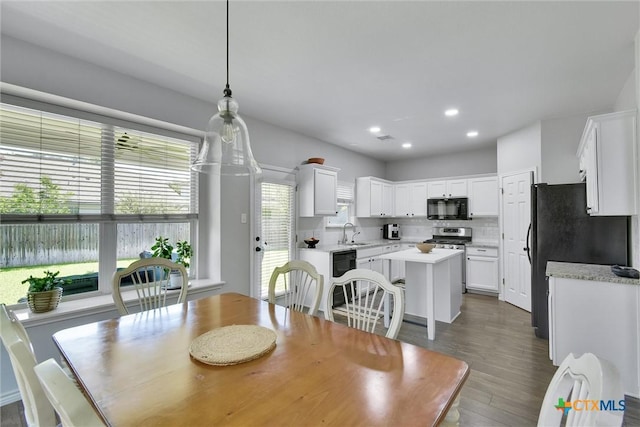 3405 Campanella Dr, Round Rock, TX 78665 - dining space with dark wood-style floors and recessed lighting