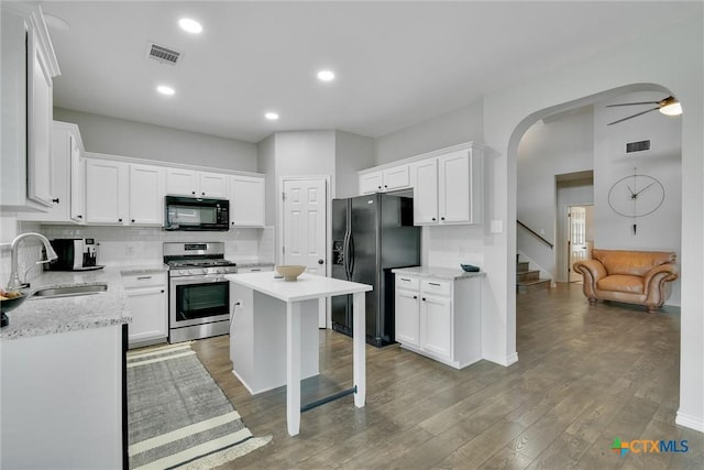3405 Campanella Dr, Round Rock, TX 78665 - kitchen featuring black appliances, a sink, backsplash, white cabinets, and ceiling fan