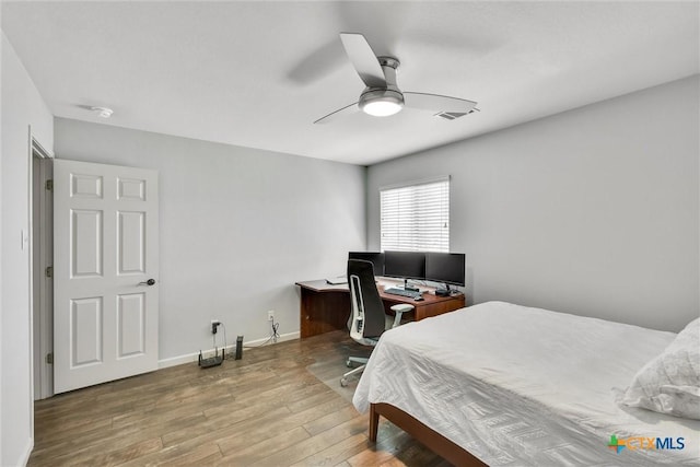 3405 Campanella Dr, Round Rock, TX 78665 - bedroom with wood finished floors, a ceiling fan, baseboards, and a desk
