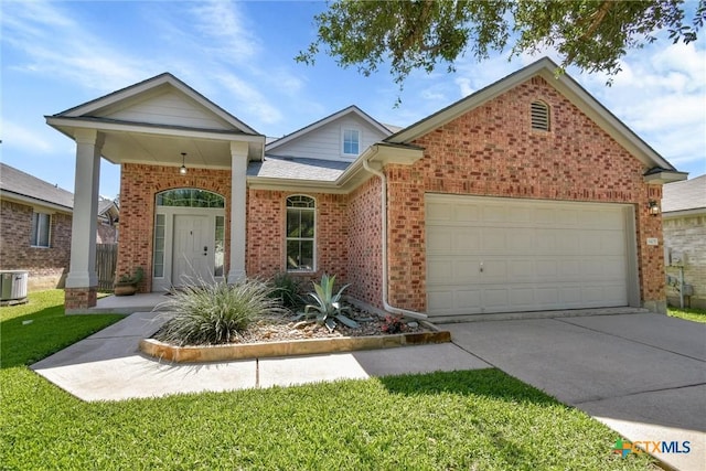 3405 Campanella Dr, Round Rock, TX 78665 - view of front of property with brick siding, a garage, driveway, and a front lawn