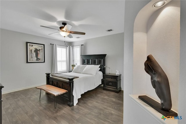 3405 Campanella Dr, Round Rock, TX 78665 - bedroom featuring dark wood-type flooring, a ceiling fan, and baseboards
