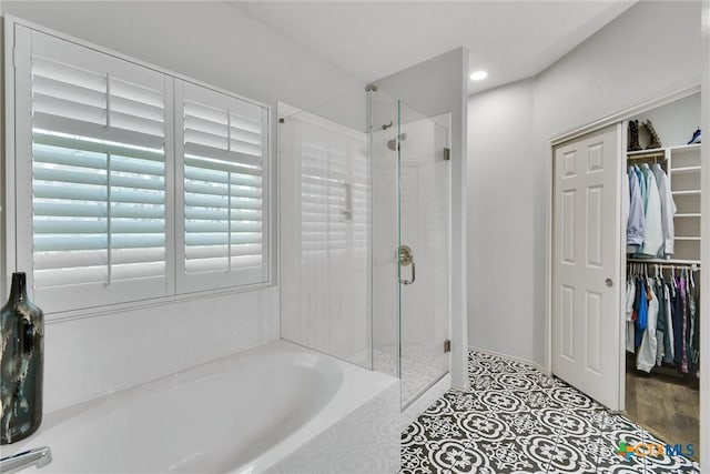 3405 Campanella Dr, Round Rock, TX 78665 - full bath with a walk in closet, a shower stall, and a garden tub