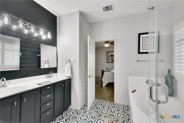 3405 Campanella Dr, Round Rock, TX 78665 - ensuite bathroom with baseboards, a bath, tile patterned flooring, a shower stall, and ceiling fan
